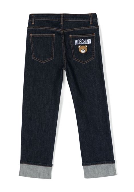 Jeans Blu Scuro Con Stampa Moschino Teddy Bear Dietro MOSCHINO KIDS | HUP063LXE4840111